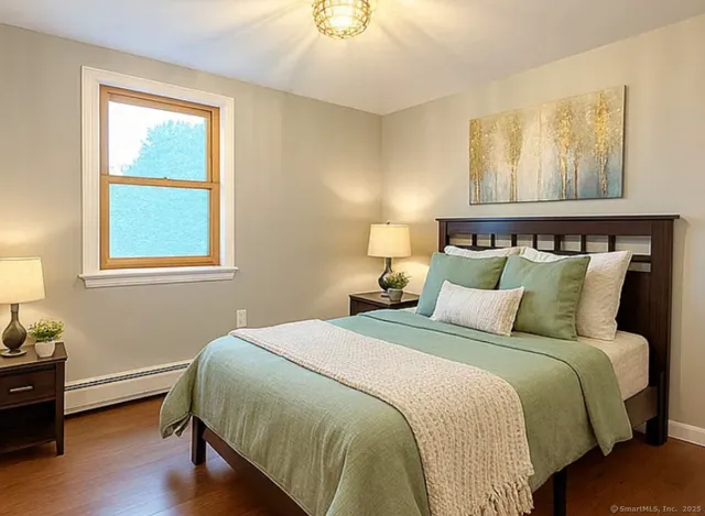 a bedroom with bed and window