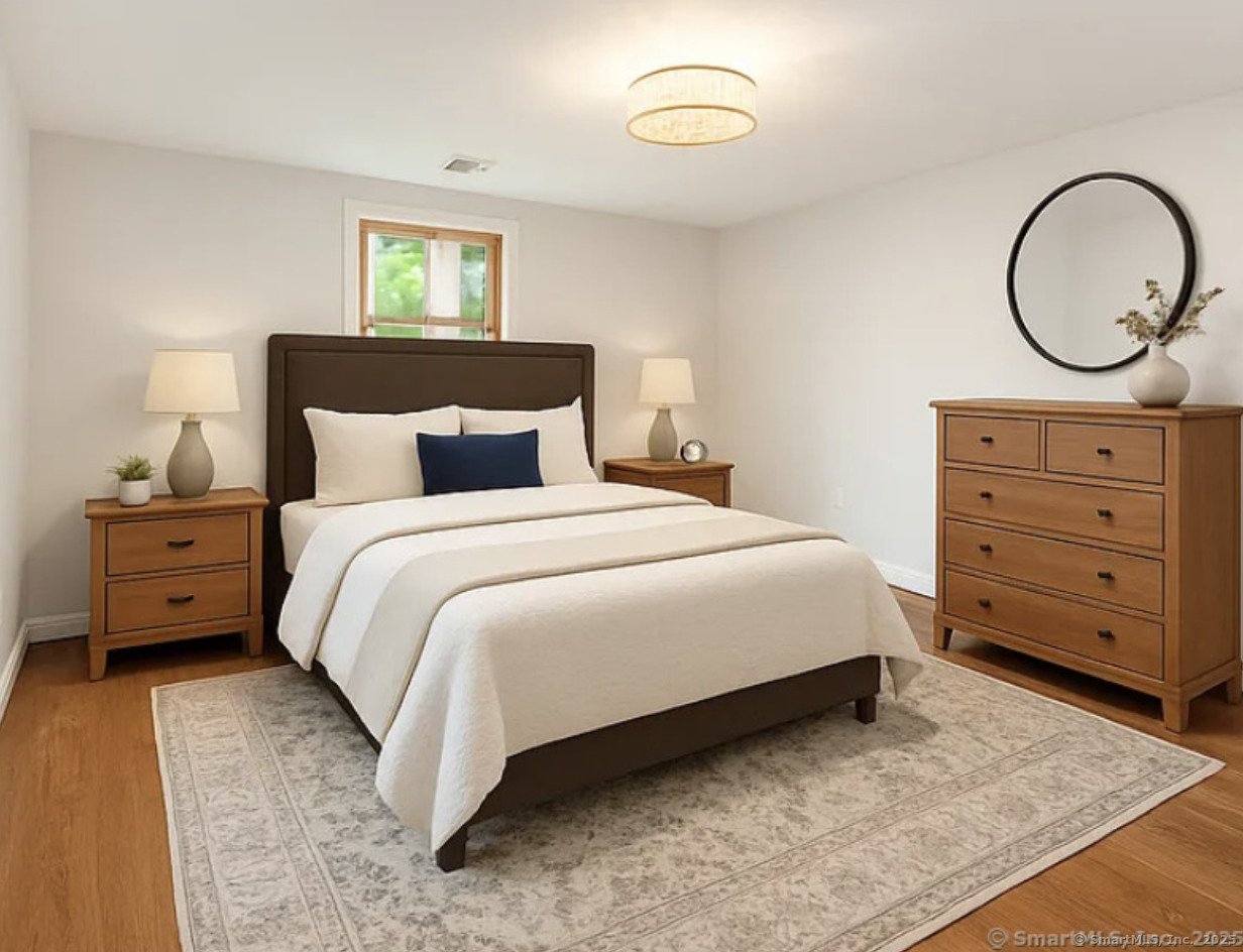 11 Pond Circle Road Westbrook, CT 06498 - Photo 8 of 15 a bedroom with a bed and a dresser