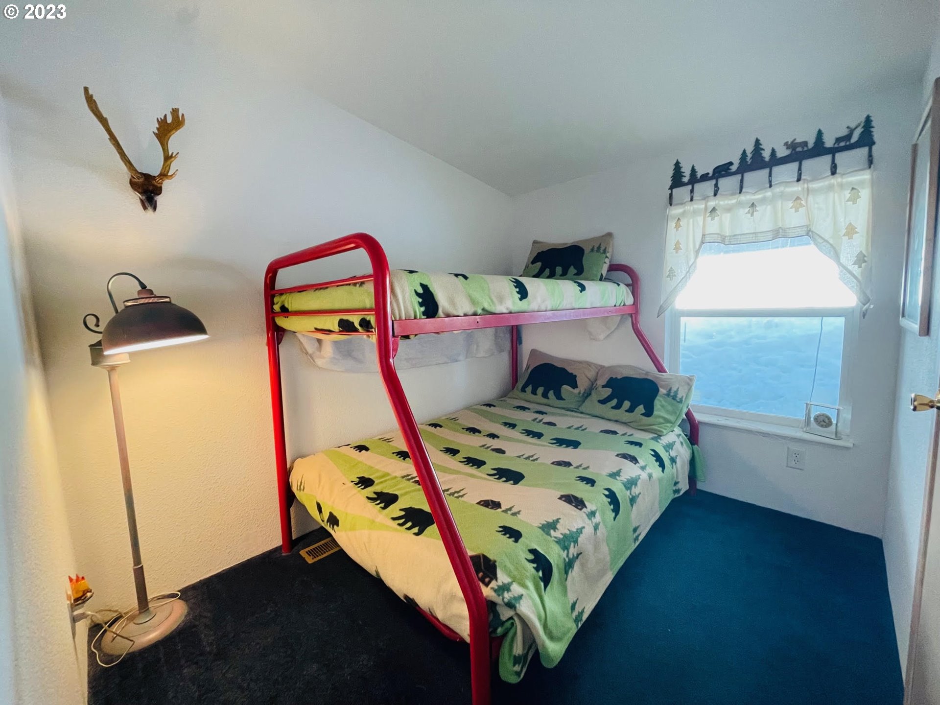 425 Bernard Lane Chemult, OR 97731 - Photo 12 of 32 a bed sitting in a bedroom next to a window