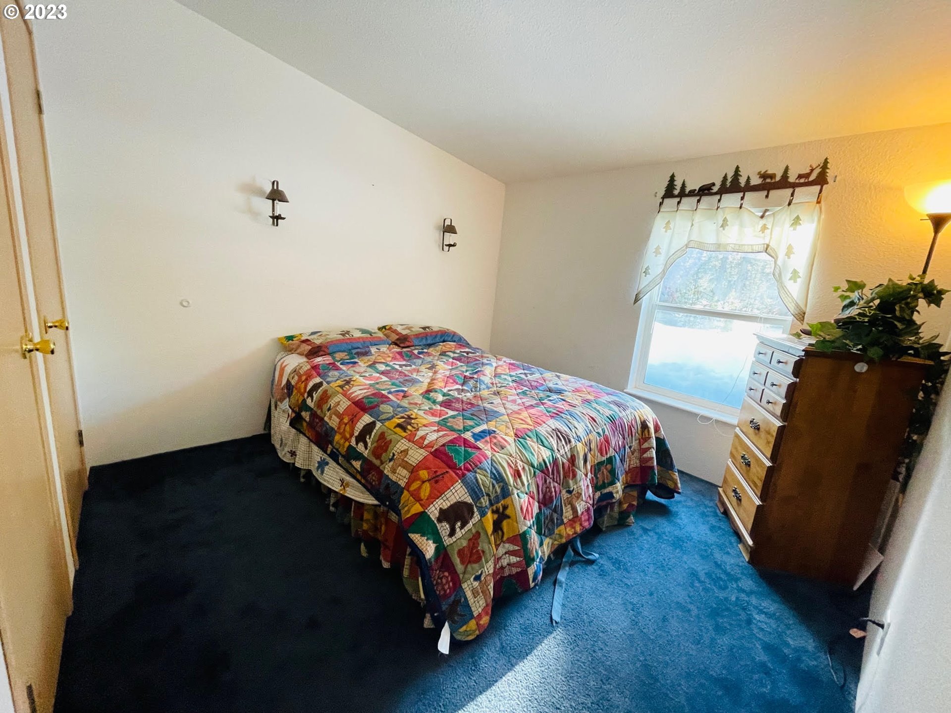 425 Bernard Lane Chemult, OR 97731 - Photo 15 of 32 a bedroom with a bed and wooden floor