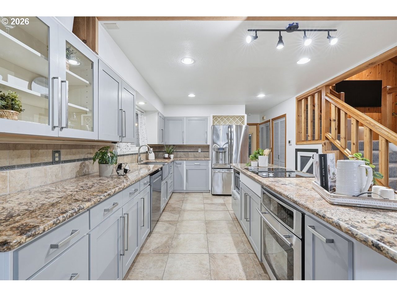 20044 South Fischers Mill Road Oregon City, OR 97045 - Photo 13 of 48 a large kitchen with stainless steel appliances kitchen island granite countertop a sink and cabinets