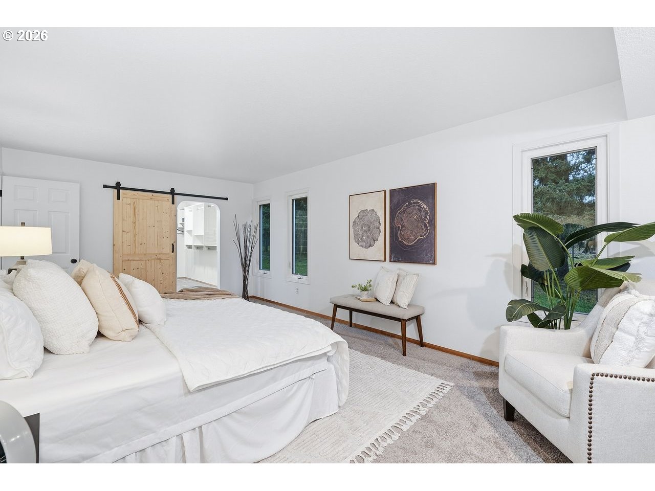 20044 South Fischers Mill Road Oregon City, OR 97045 - Photo 17 of 48 a bedroom with a bed and wooden floor
