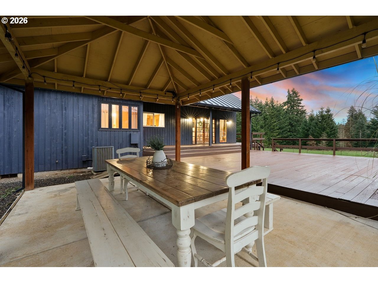 20044 South Fischers Mill Road Oregon City, OR 97045 - Photo 29 of 48 a view of a backyard with table and chairs under an umbrella