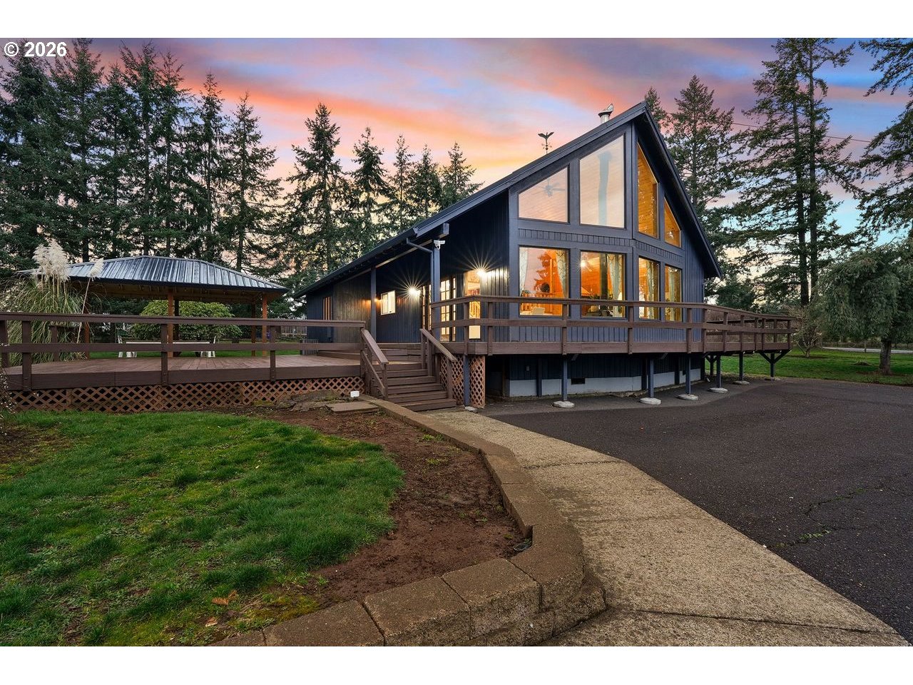 20044 South Fischers Mill Road Oregon City, OR 97045 - Photo 3 of 48 a front view of a house with a yard and trees