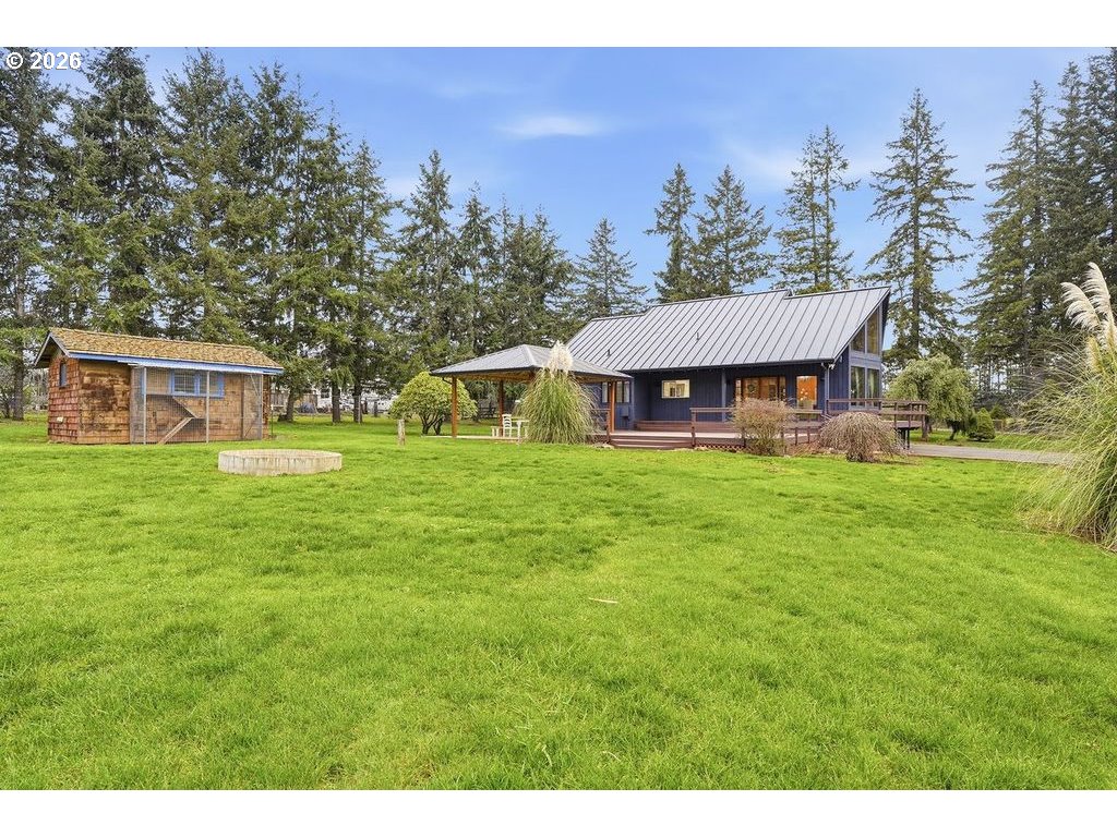 20044 South Fischers Mill Road Oregon City, OR 97045 - Photo 31 of 48 a view of a house with a yard table and chairs