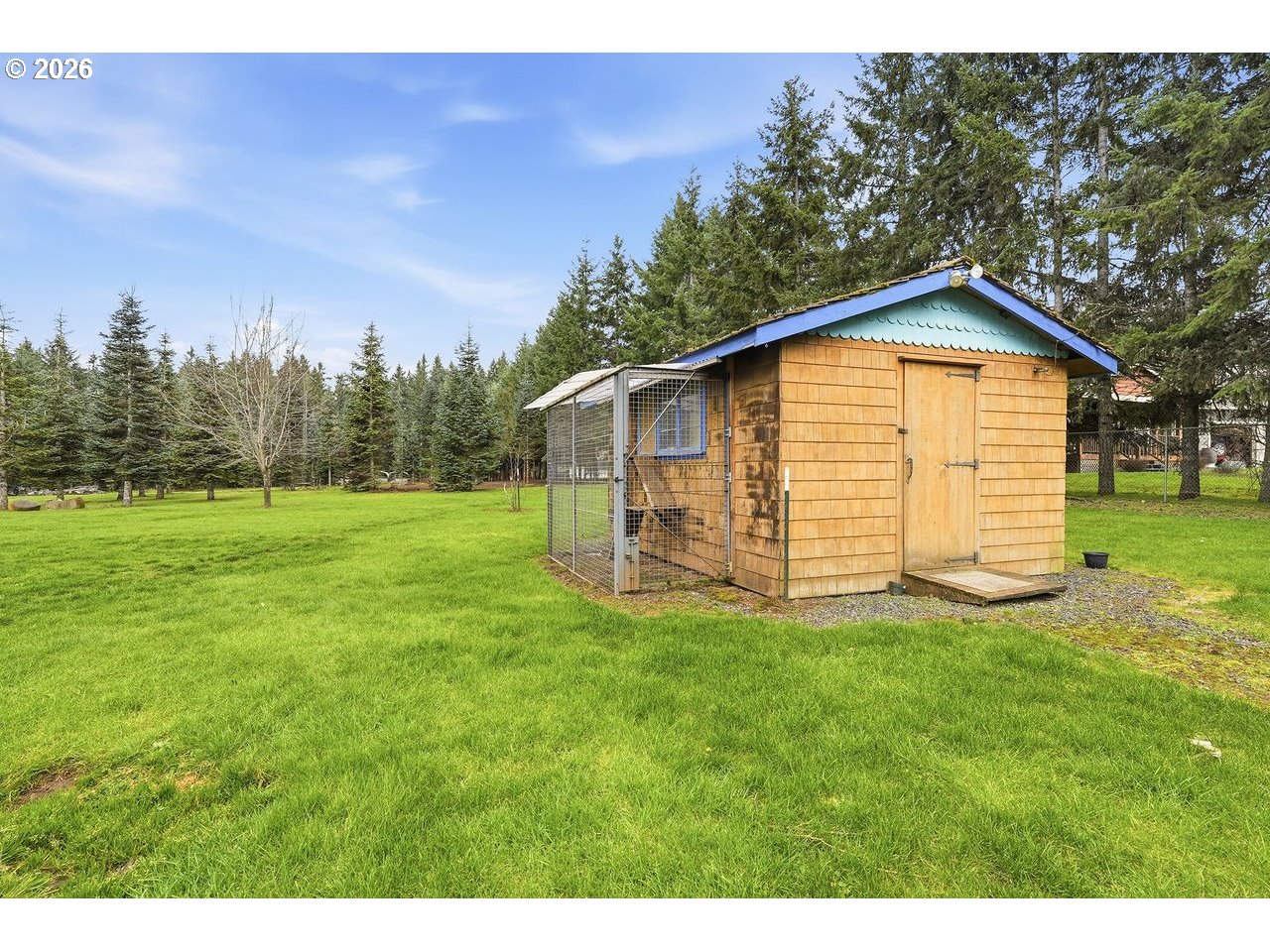 20044 South Fischers Mill Road Oregon City, OR 97045 - Photo 35 of 48 a view of a backyard with a garden
