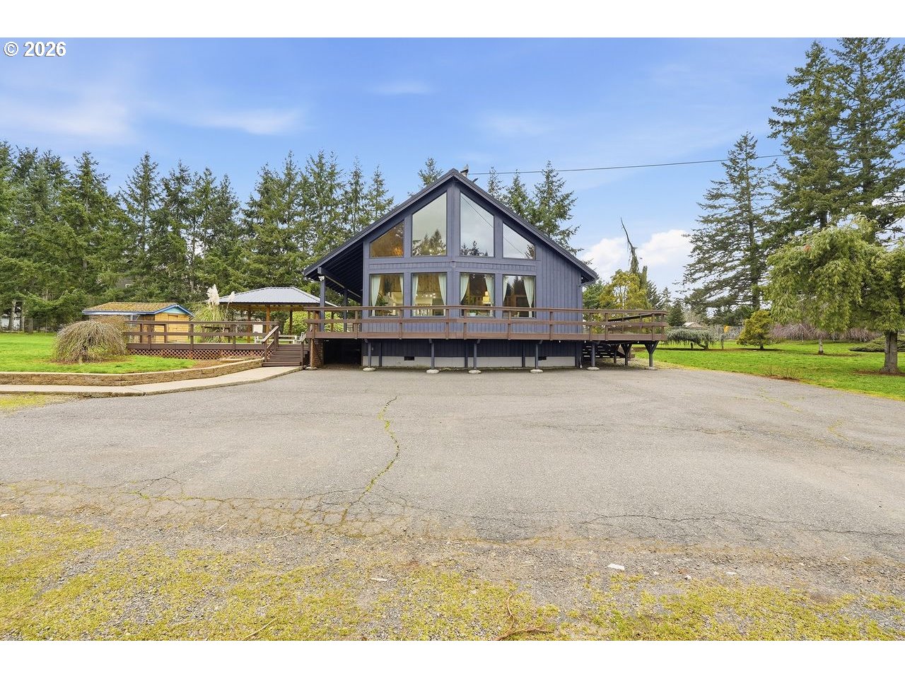 20044 South Fischers Mill Road Oregon City, OR 97045 - Photo 42 of 48 a view of a house with a yard and a large tree