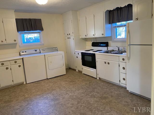 302 Prospect Road Hurt, VA 24563 - Photo 4 of 9 a kitchen with white cabinets and white appliances