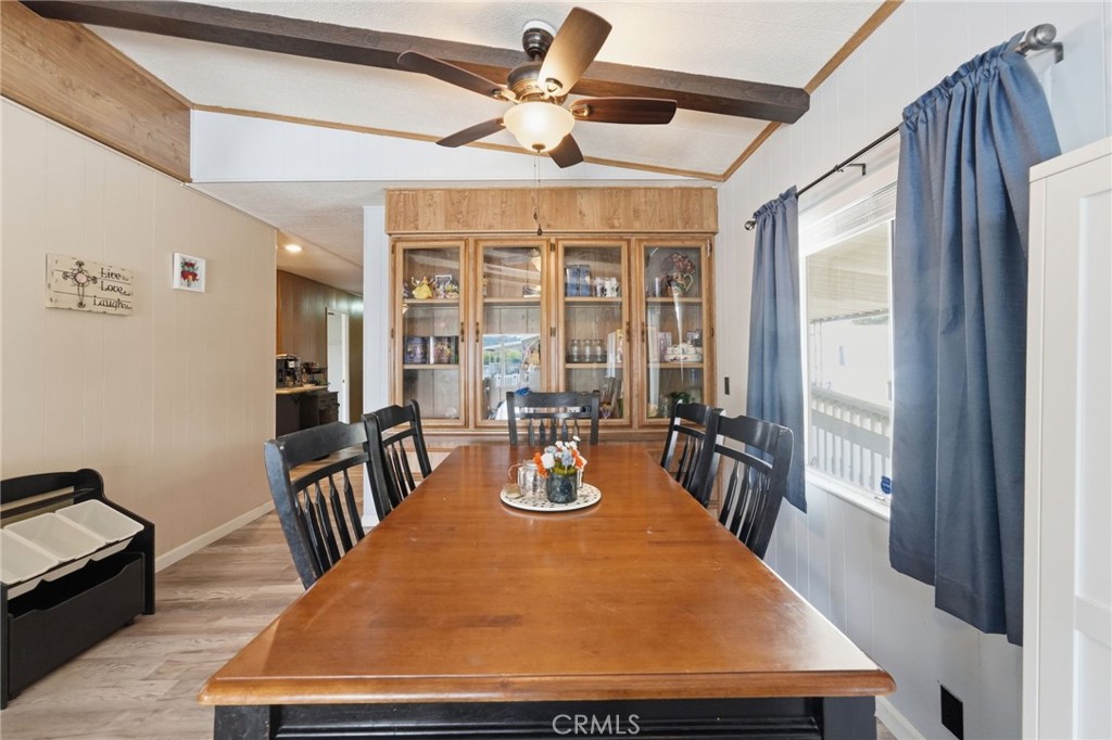15181 Van Buren Boulevard, Unit 85 Riverside, CA 92504 - Photo 11 of 54 a dining room with wooden floor and furniture