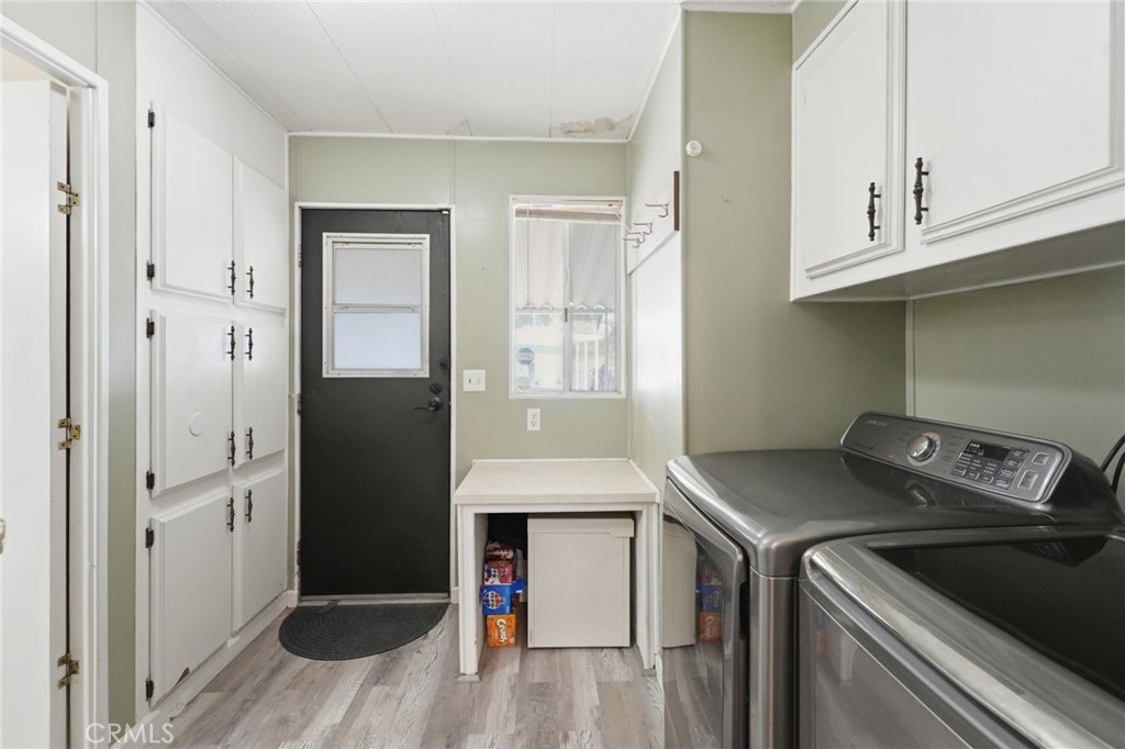 15181 Van Buren Boulevard, Unit 85 Riverside, CA 92504 - Photo 14 of 54 a utility room with dryer and washer