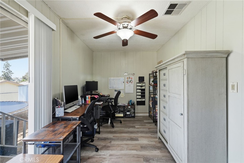 15181 Van Buren Boulevard, Unit 85 Riverside, CA 92504 - Photo 16 of 54 a view of a workspace with furniture and a window