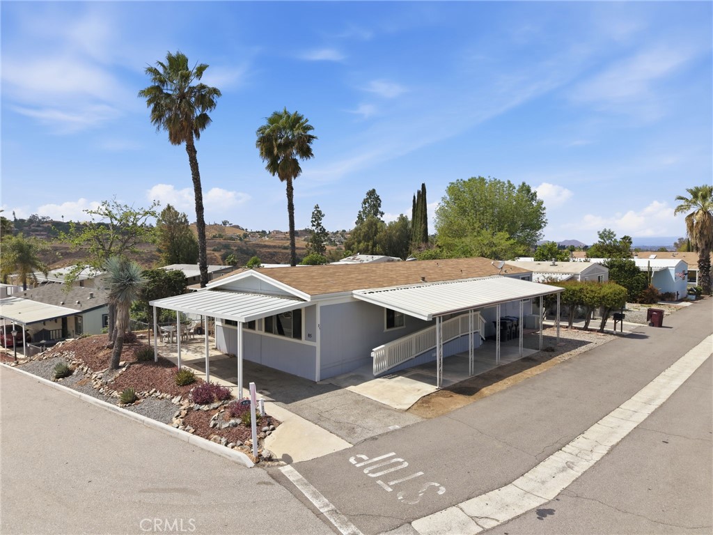 15181 Van Buren Boulevard, Unit 85 Riverside, CA 92504 - Photo 2 of 54 a view of a terrace with sitting area