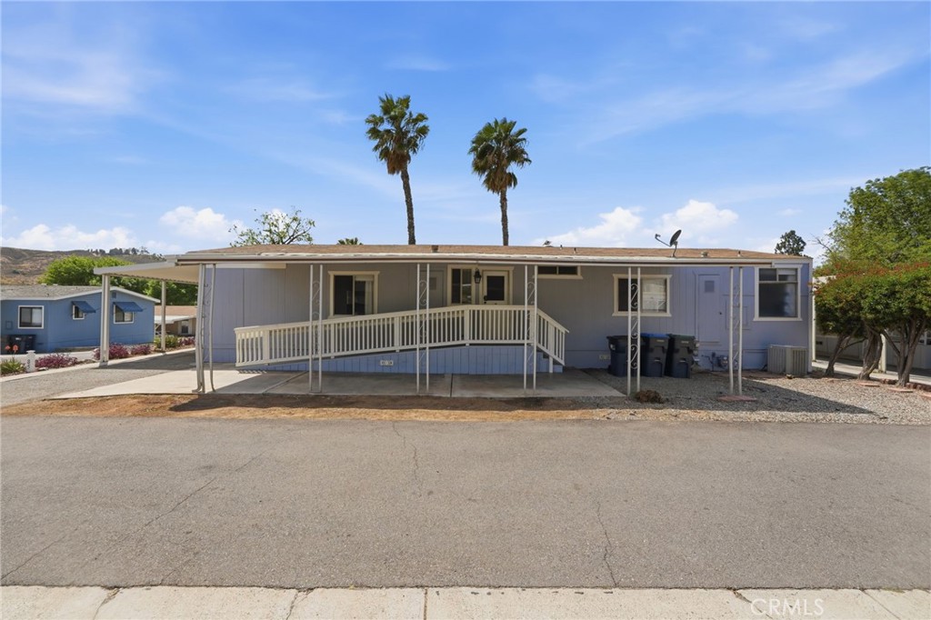 15181 Van Buren Boulevard, Unit 85 Riverside, CA 92504 - Photo 25 of 54 a view of a house with a swimming pool