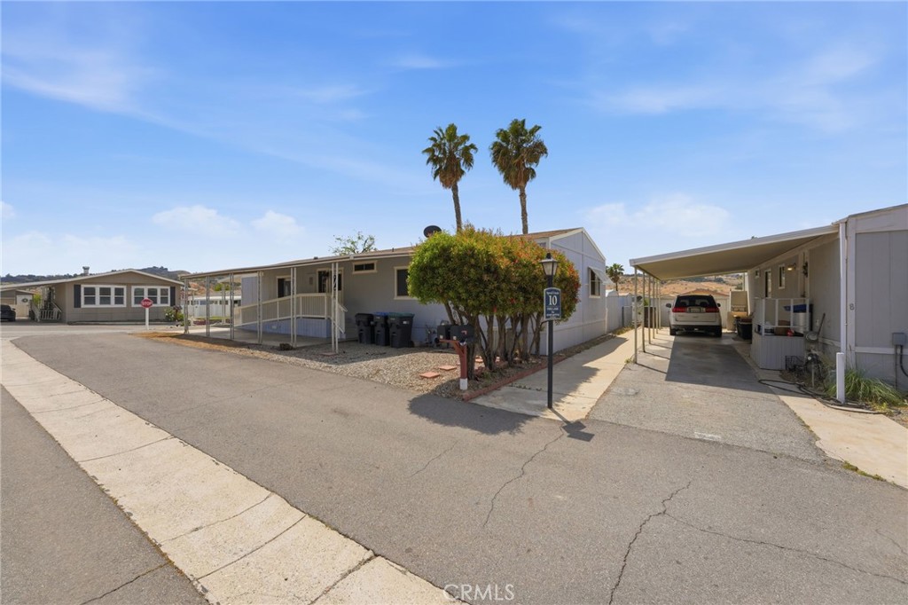 15181 Van Buren Boulevard, Unit 85 Riverside, CA 92504 - Photo 26 of 54 a view of a street with cars
