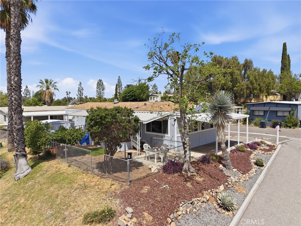 15181 Van Buren Boulevard, Unit 85 Riverside, CA 92504 - Photo 3 of 54 a view of a chairs and table in patio