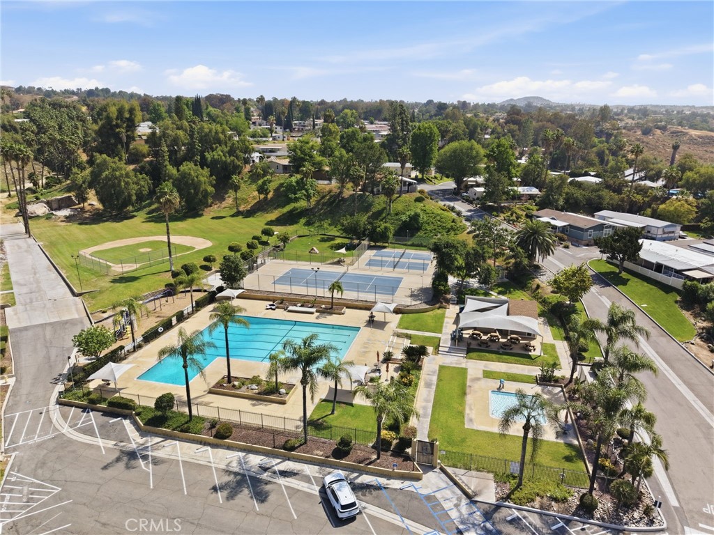 15181 Van Buren Boulevard, Unit 85 Riverside, CA 92504 - Photo 33 of 54 an aerial view of residential houses with outdoor space