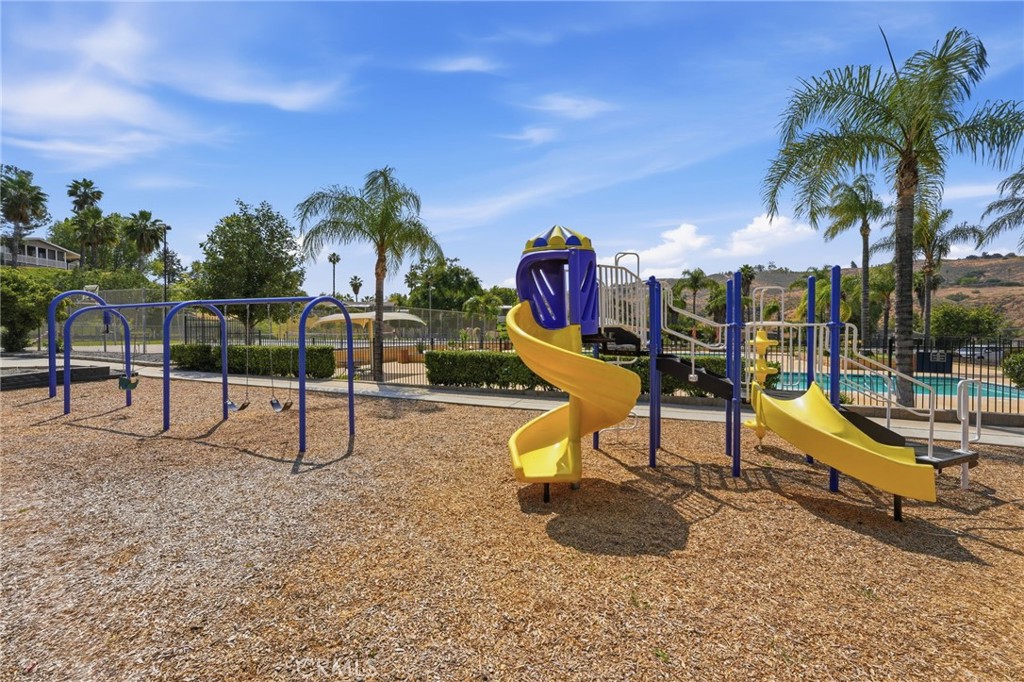 15181 Van Buren Boulevard, Unit 85 Riverside, CA 92504 - Photo 36 of 54 a view of a park with slide