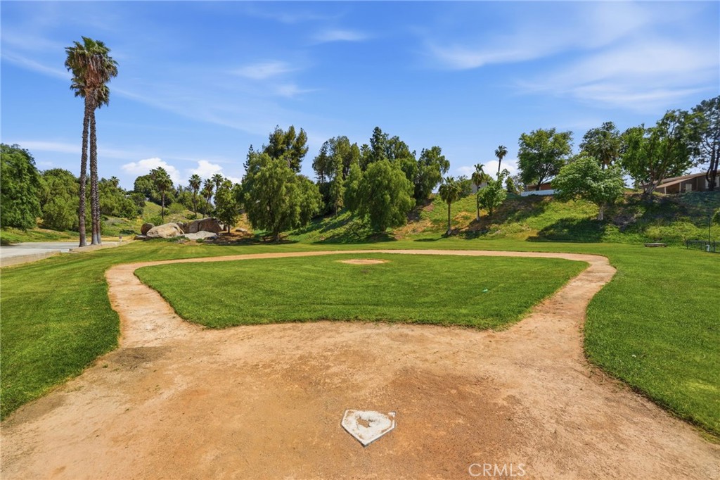 15181 Van Buren Boulevard, Unit 85 Riverside, CA 92504 - Photo 39 of 54 a view of a golf course with a garden