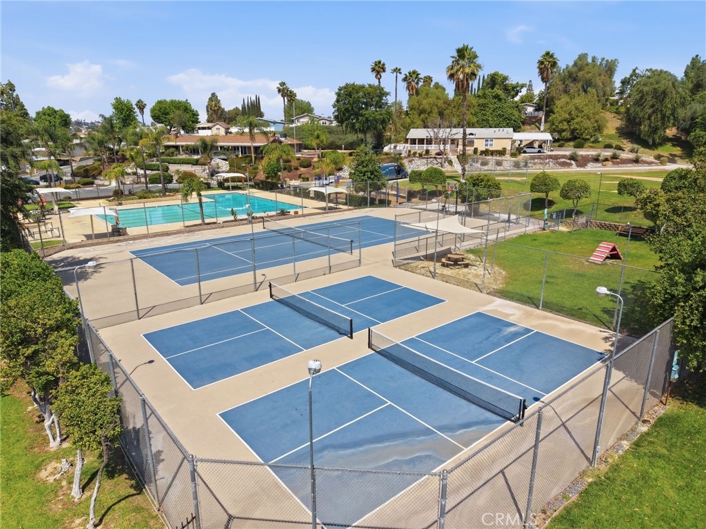 15181 Van Buren Boulevard, Unit 85 Riverside, CA 92504 - Photo 44 of 54 a view of a tennis court