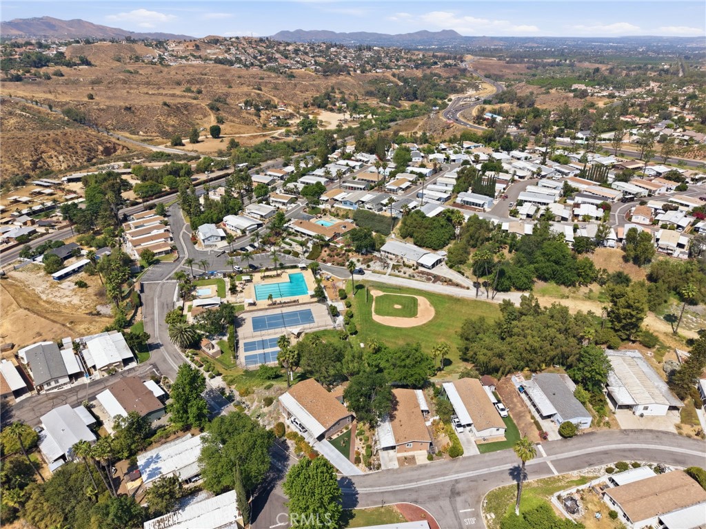 15181 Van Buren Boulevard, Unit 85 Riverside, CA 92504 - Photo 45 of 54 an aerial view of residential house with outdoor space