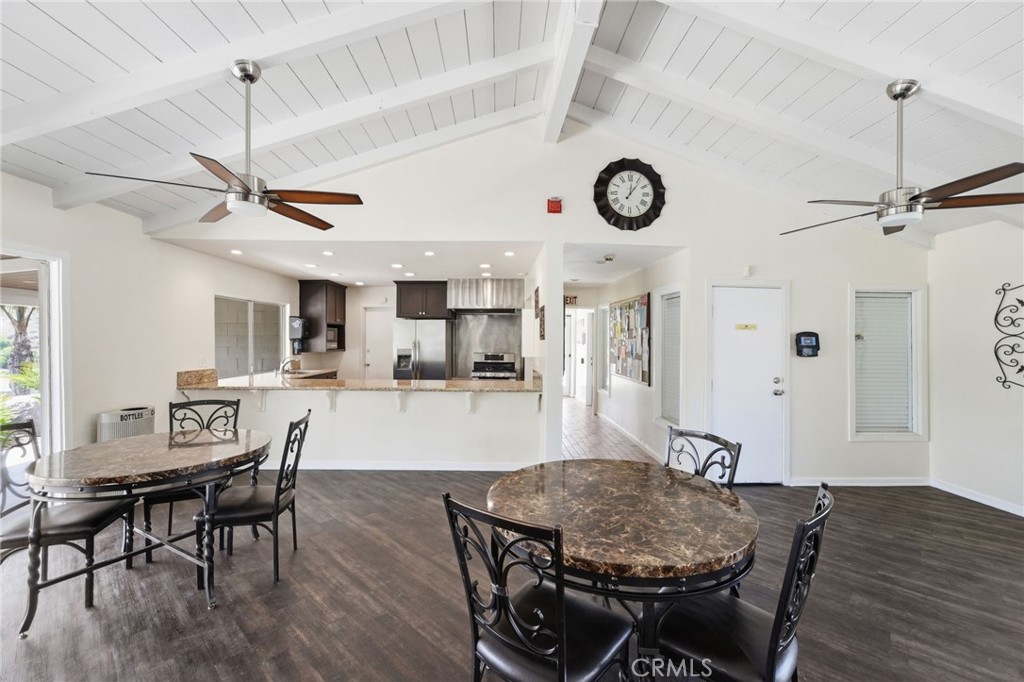 15181 Van Buren Boulevard, Unit 85 Riverside, CA 92504 - Photo 48 of 54 a view of a dining room with furniture and wooden floor
