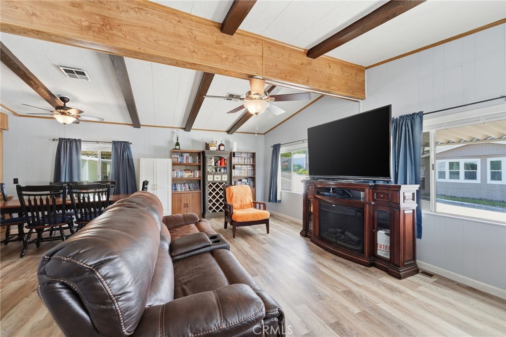 15181 Van Buren Boulevard, Unit 85 Riverside, CA 92504 - Photo 54 of 54 a living room with furniture and a flat screen tv