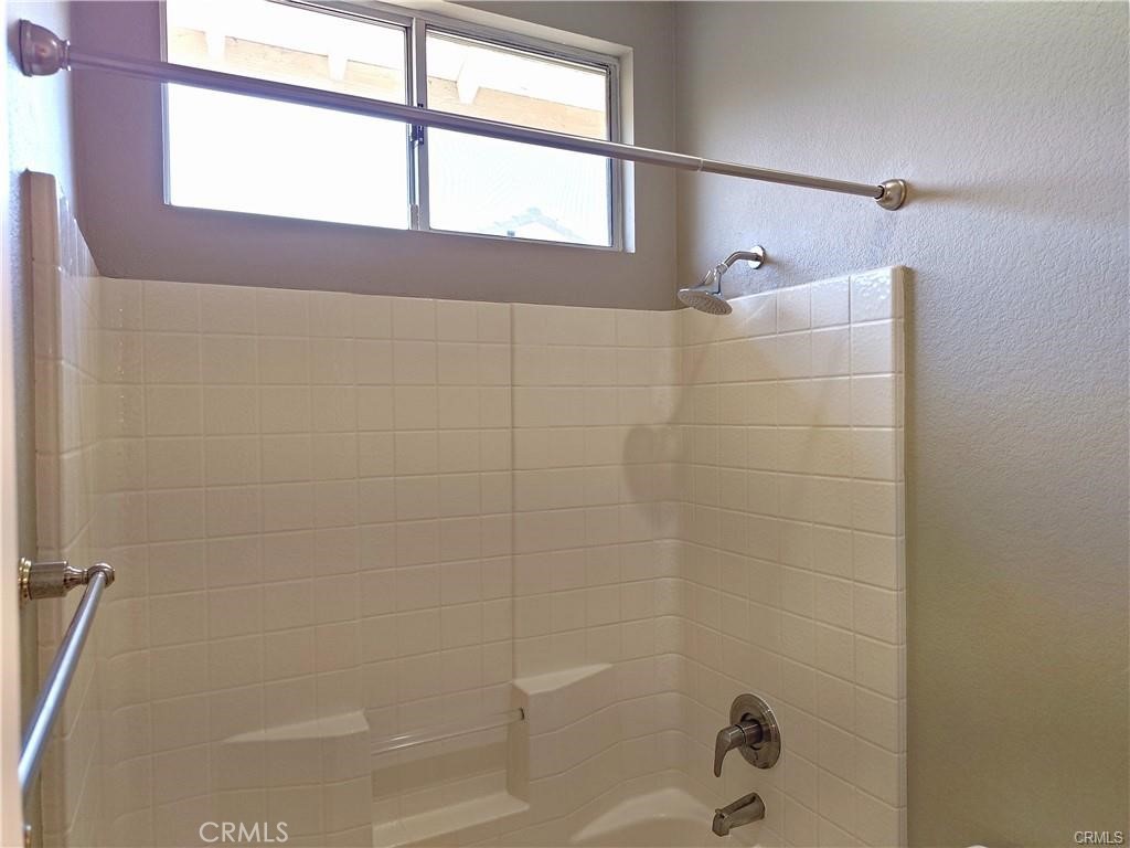 33039 Harmony Lane Temecula, CA 92592 - Photo 15 of 17 a bathroom with a shower