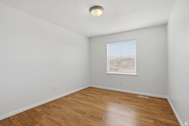 2007 Fielding Hill Lane Draper, UT 84020 - Photo 29 of 83 Neutral interior with wood-finish flooring, white baseboards, a single window with blinds, and a ceiling-mounted light fixture