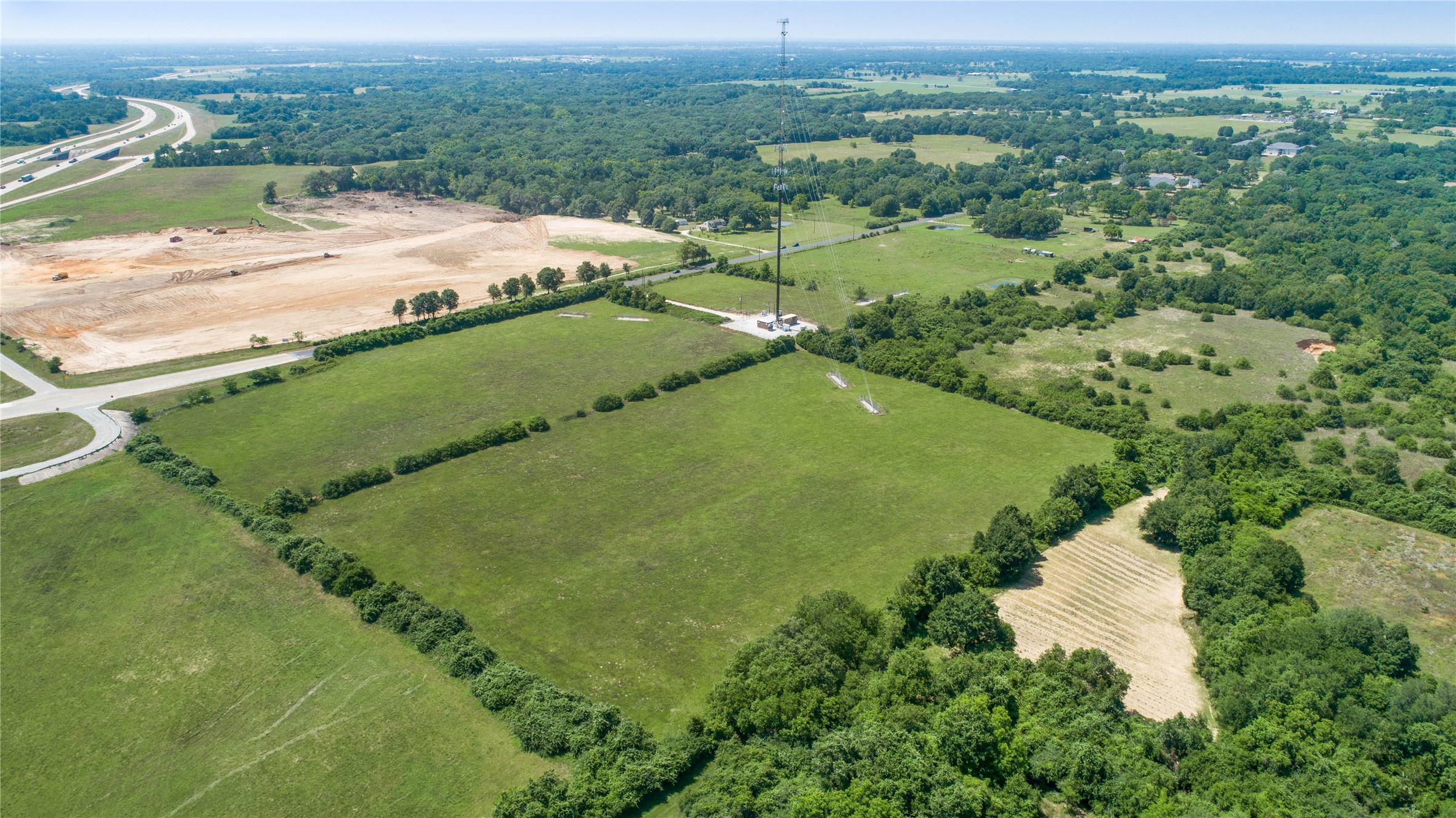 Lot 1 Richards Road Prairie View, TX 77445 - Photo 3 of 16 an aerial view of a house with a yard and lake view
