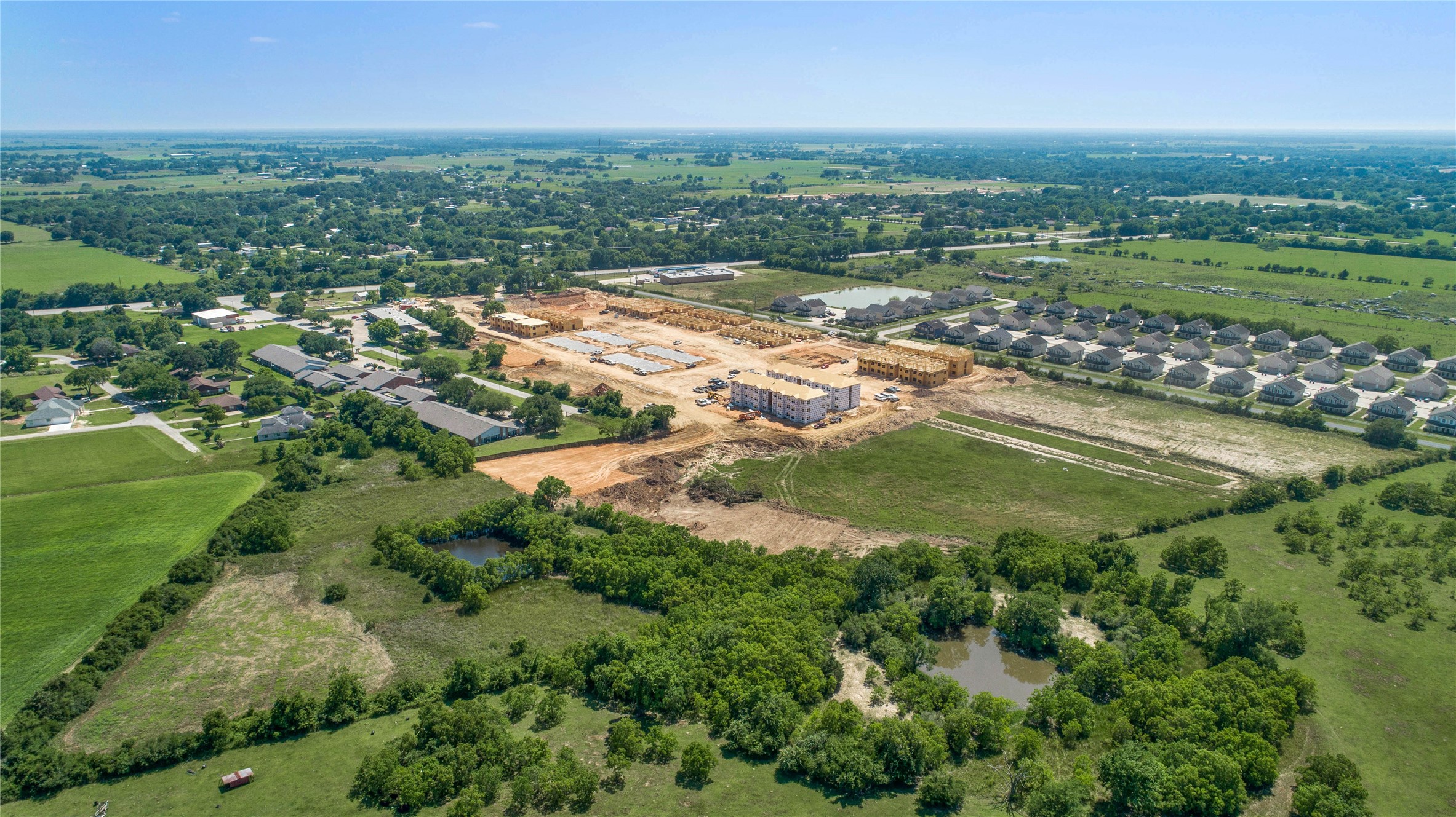 Lot 1 Richards Road Prairie View, TX 77445 - Photo 4 of 16 an aerial view of residential houses with outdoor space and trees