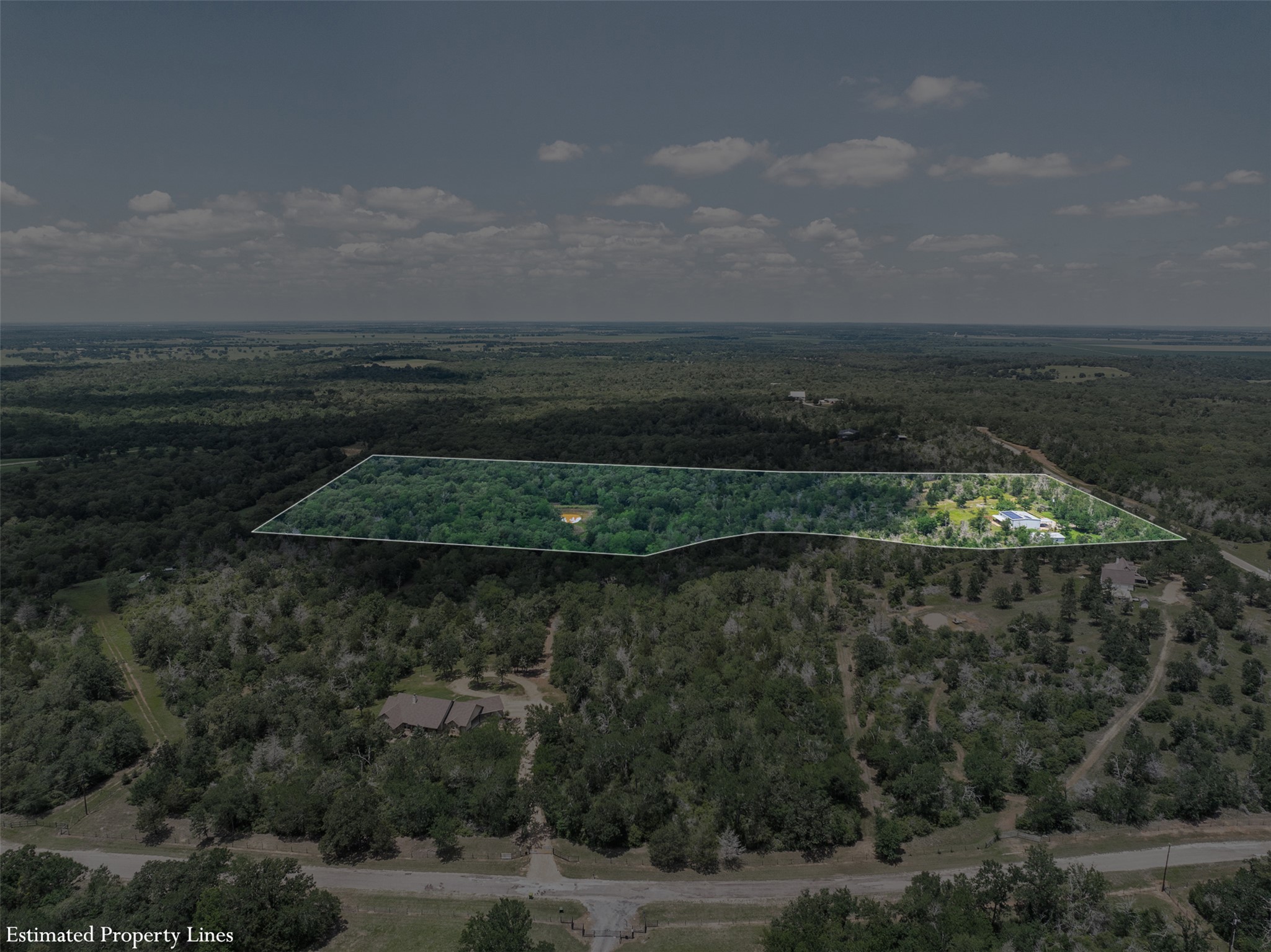 1004 22 Hills Road Gause, TX 77857 - Photo 5 of 37 Discover vast, undeveloped acreage, offering a blank canvas for your dream estate amid serene woodlands.