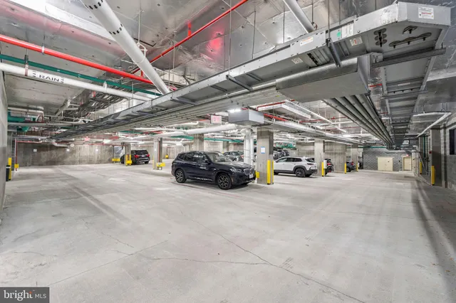 a view of parking garage with cars
