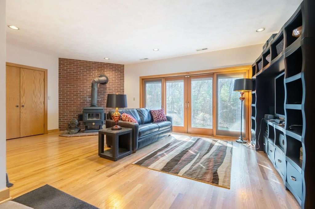 8 Cameron Road Andover, MA 01810 - Photo 23 of 42 a living room with furniture and a flat screen tv