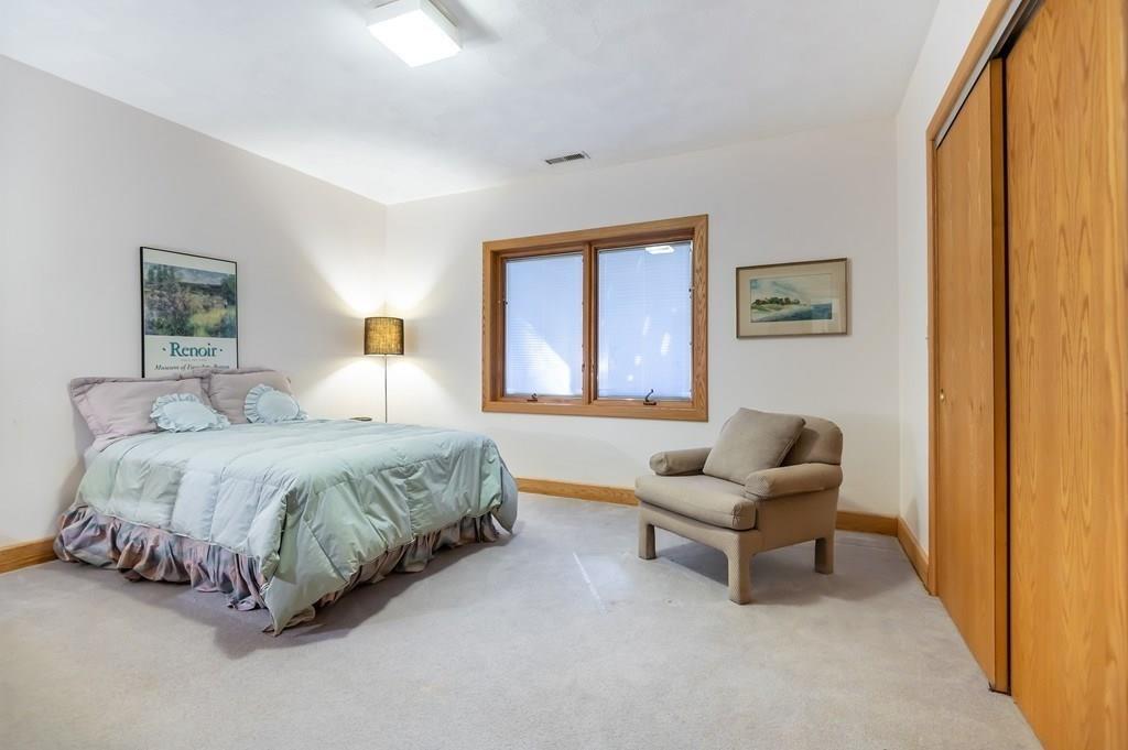 8 Cameron Road Andover, MA 01810 - Photo 24 of 42 a spacious bedroom with a bed and a couch