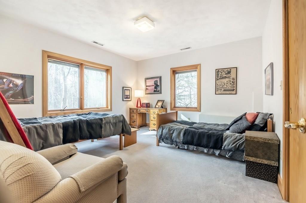 8 Cameron Road Andover, MA 01810 - Photo 25 of 42 a living room with a couch and a window