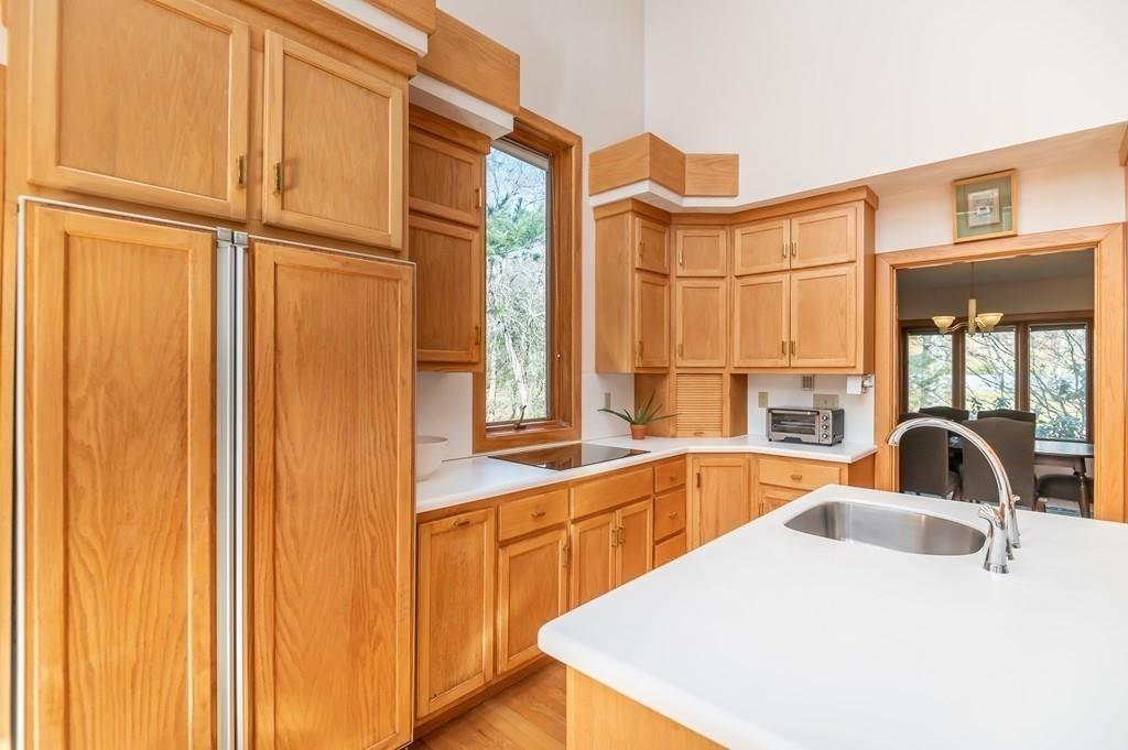 8 Cameron Road Andover, MA 01810 - Photo 27 of 42 a kitchen with stainless steel appliances a sink and a large window
