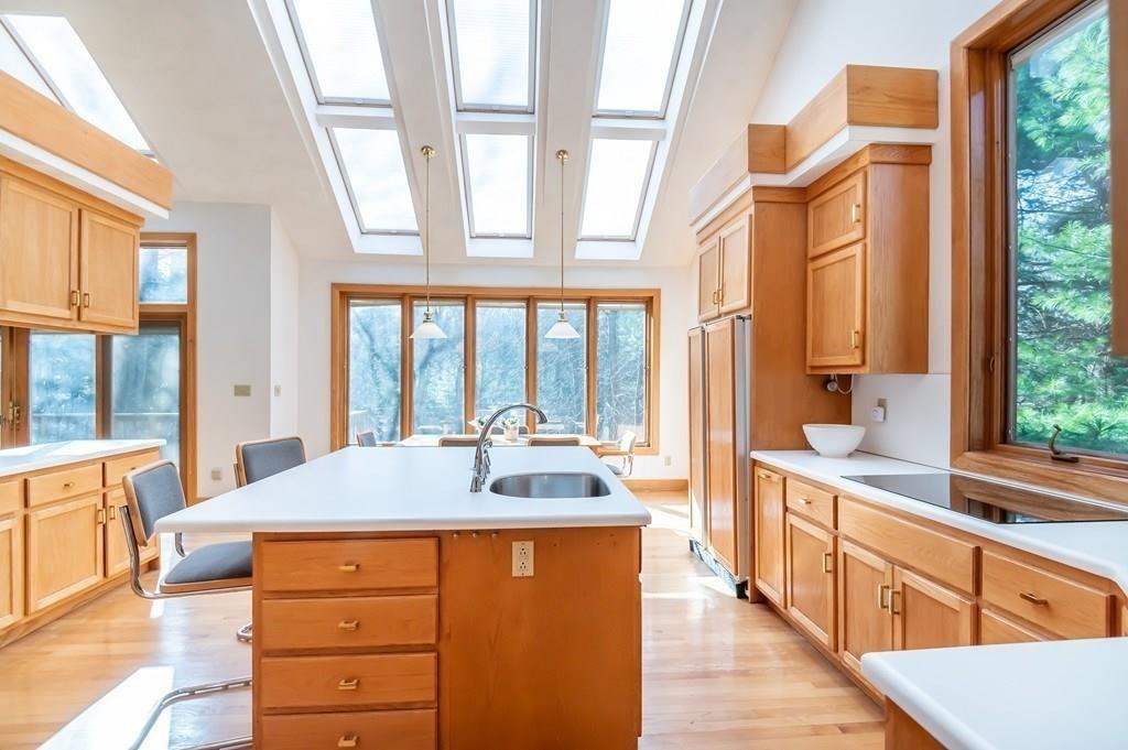 8 Cameron Road Andover, MA 01810 - Photo 29 of 42 a large kitchen with a large window and furniture