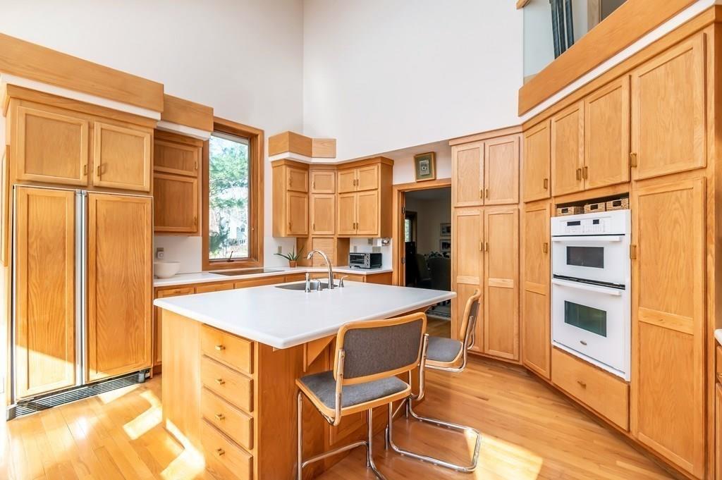 8 Cameron Road Andover, MA 01810 - Photo 30 of 42 a kitchen that has a stove and a table