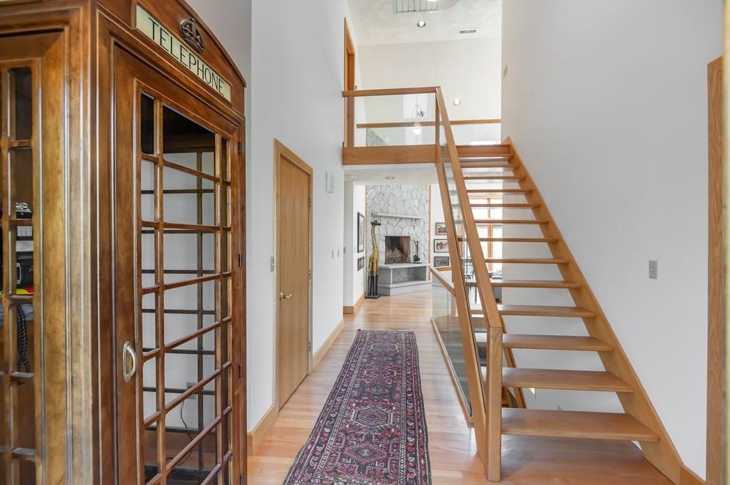 8 Cameron Road Andover, MA 01810 - Photo 4 of 42 a view of a hallway with wooden floor and entryway