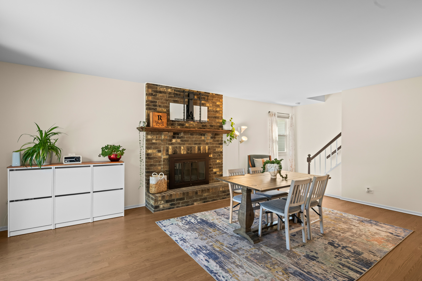 S579 Robbins Street Winfield, IL 60190 - Photo 14 of 36 a dining room with furniture and wooden floor