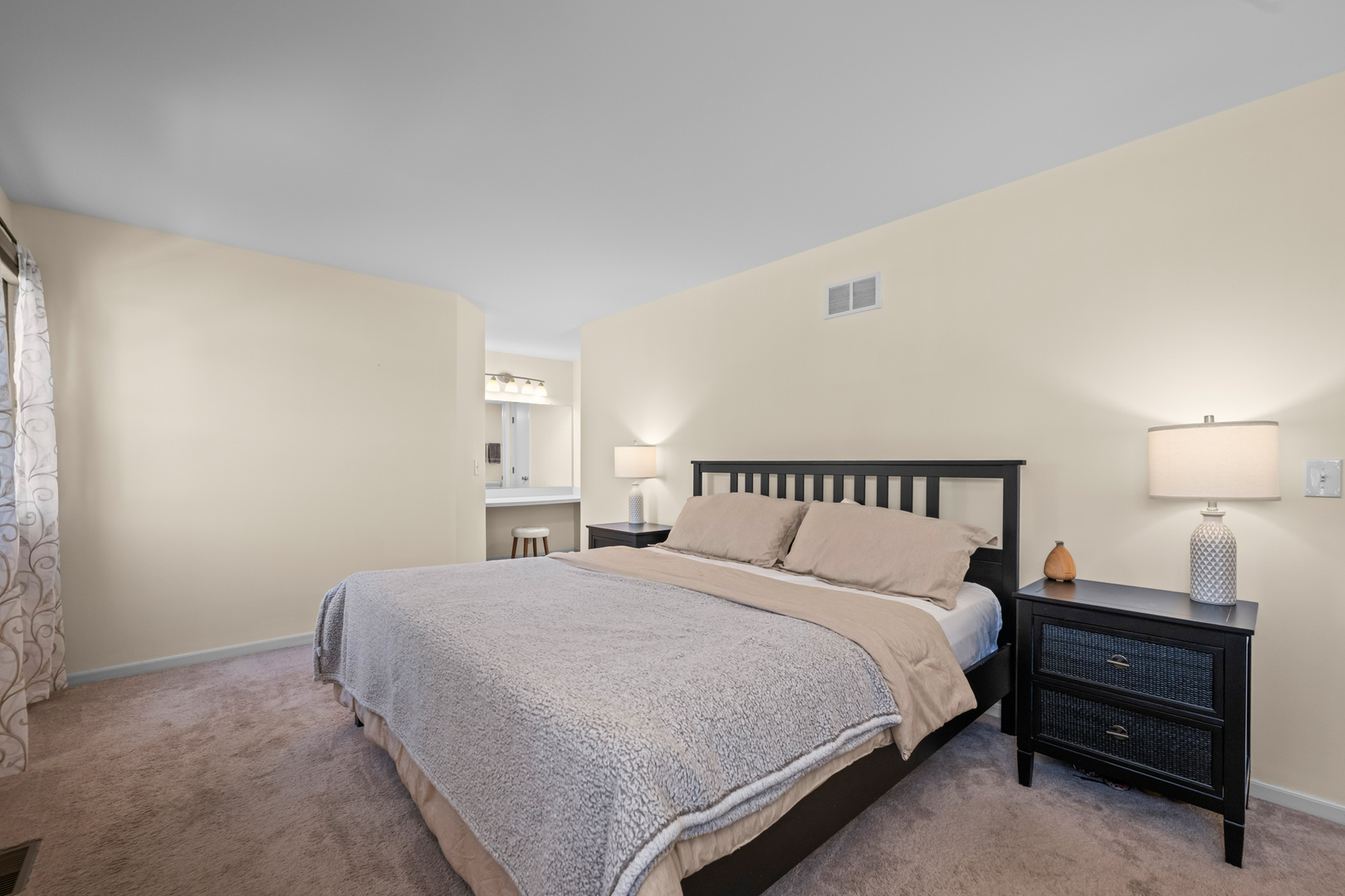 S579 Robbins Street Winfield, IL 60190 - Photo 18 of 36 a bedroom with a bed and a lamp on table
