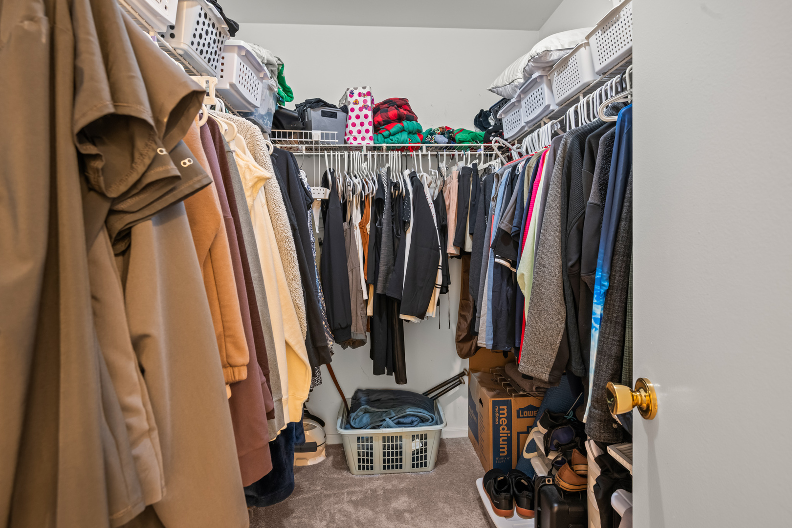 S579 Robbins Street Winfield, IL 60190 - Photo 21 of 36 a view of walk in closet with clothes