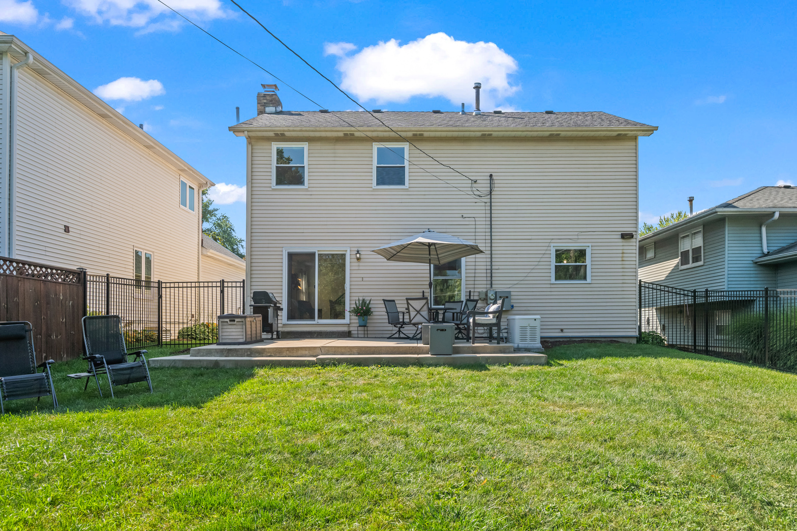 S579 Robbins Street Winfield, IL 60190 - Photo 28 of 36 a front view of house with yard and seating area