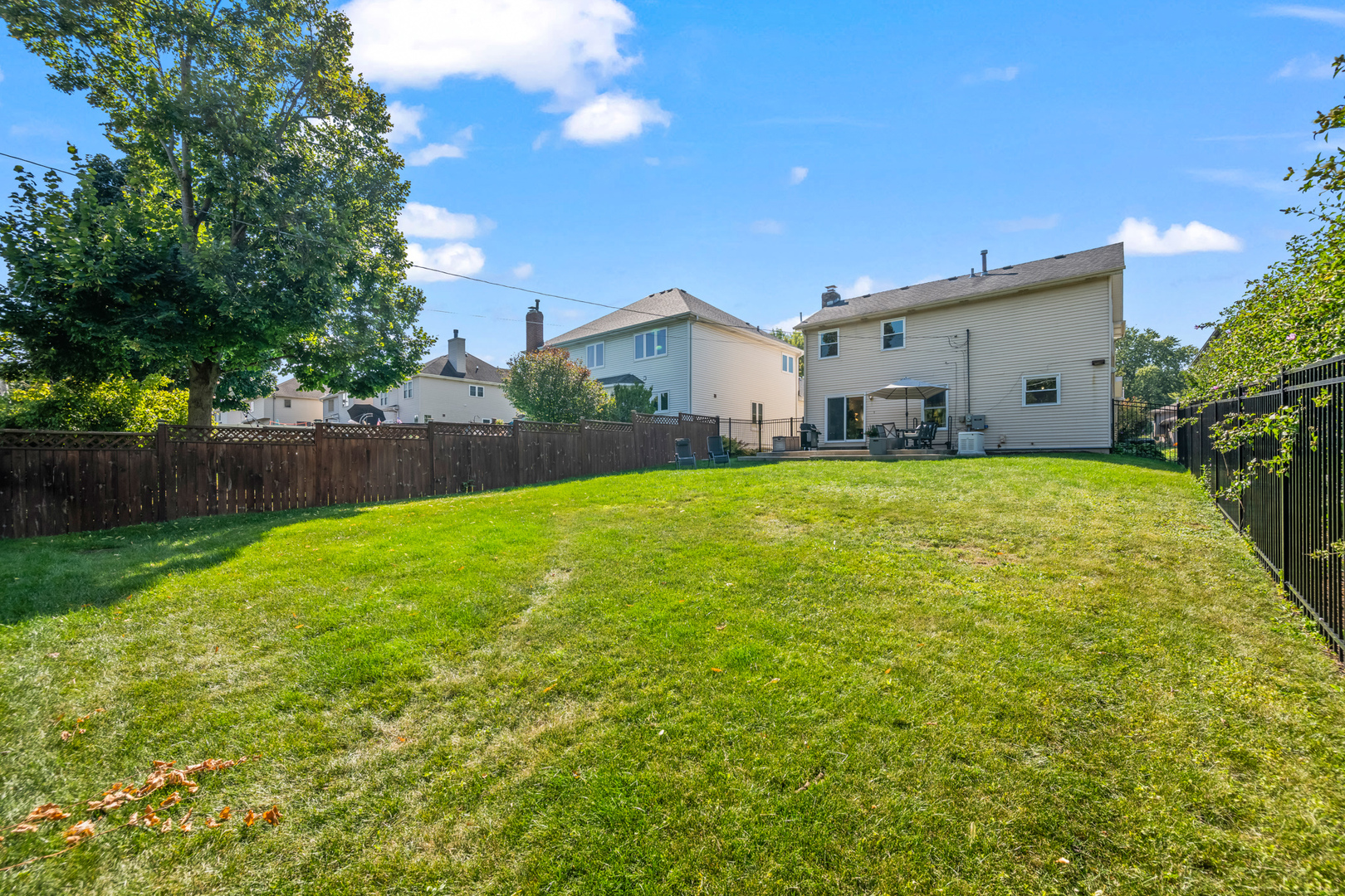 S579 Robbins Street Winfield, IL 60190 - Photo 30 of 36 a view of a house with a yard and a garage