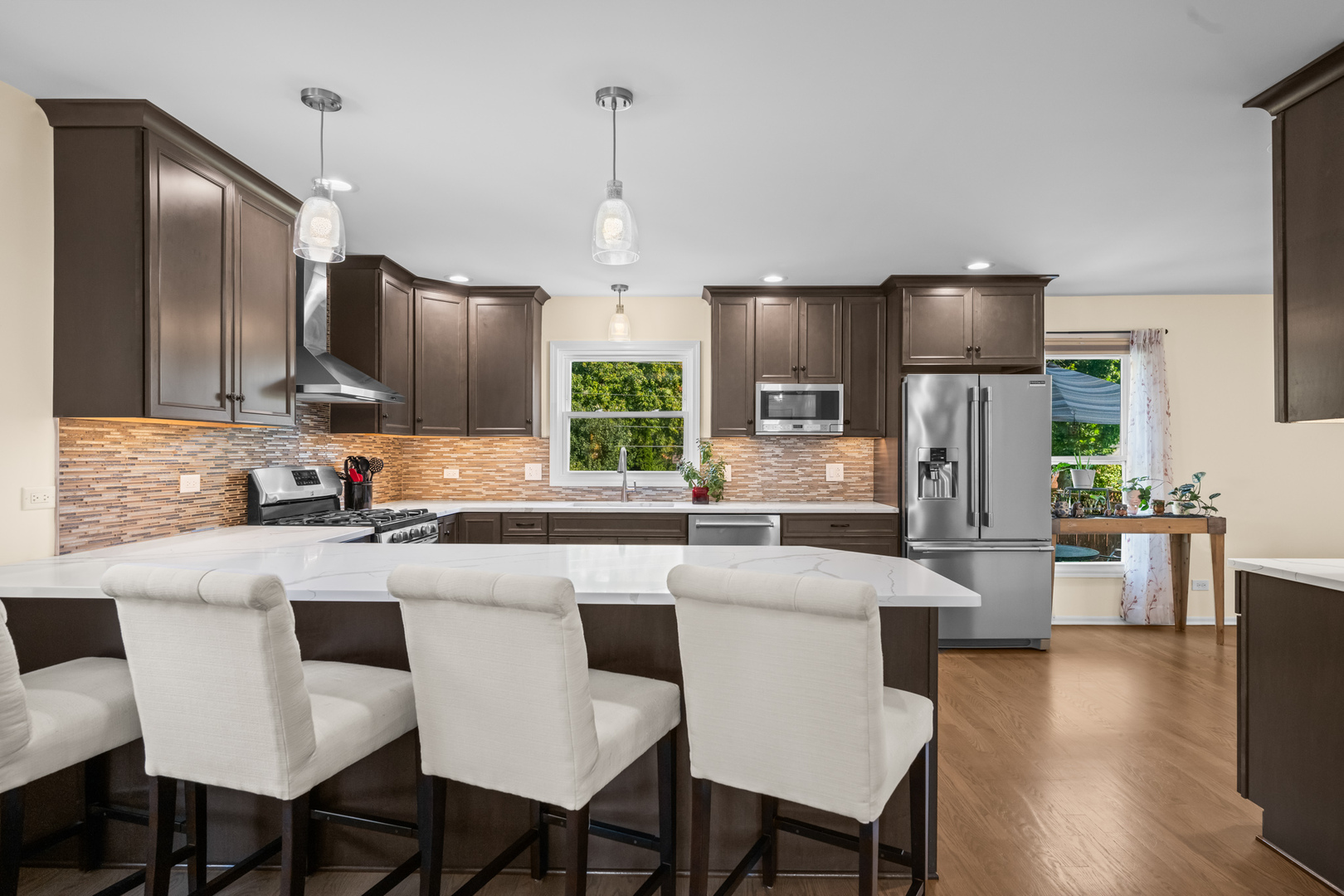 S579 Robbins Street Winfield, IL 60190 - Photo 3 of 36 a large kitchen with kitchen island a large island in the center