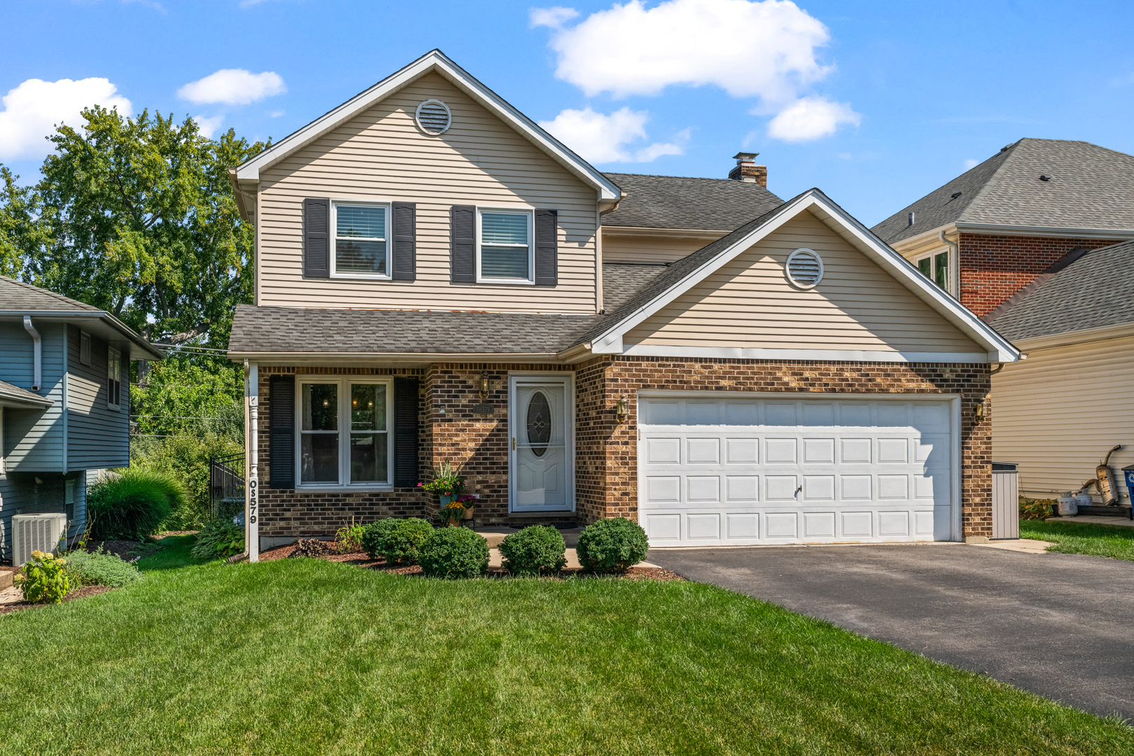 S579 Robbins Street Winfield, IL 60190 - Photo 36 of 36 a front view of a house with a yard and garage