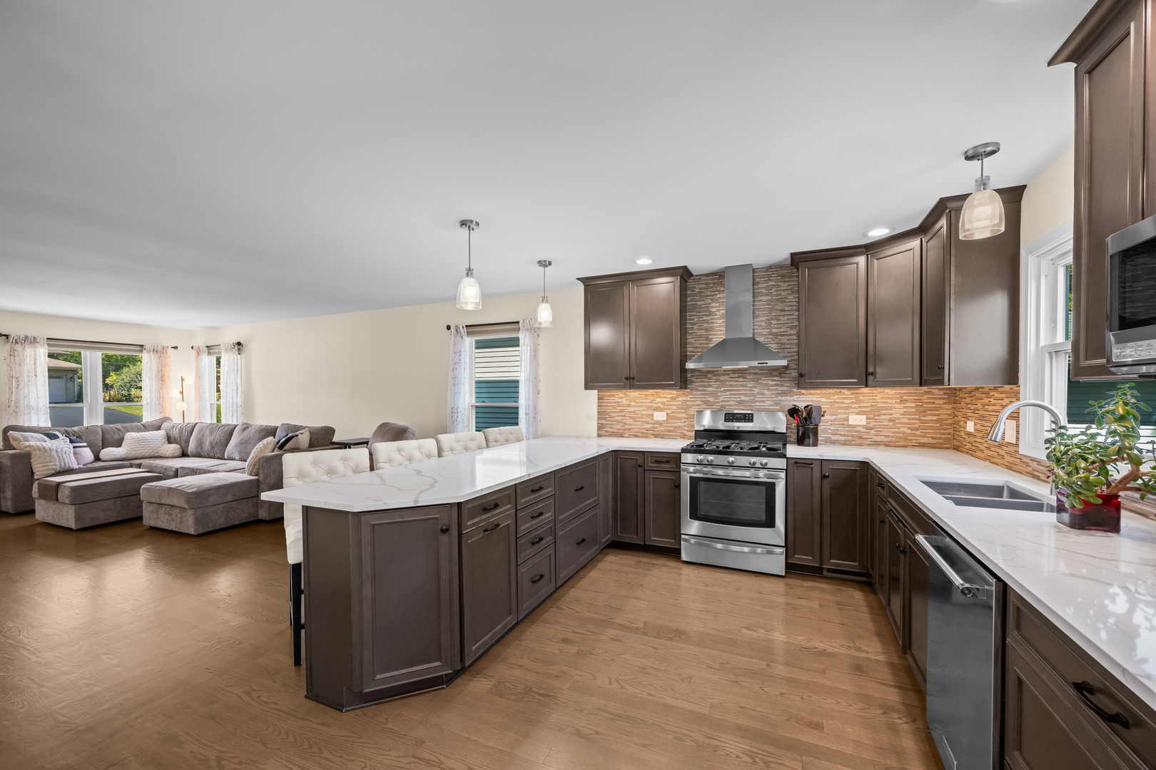 S579 Robbins Street Winfield, IL 60190 - Photo 4 of 36 a large kitchen with a stove sink and cabinets