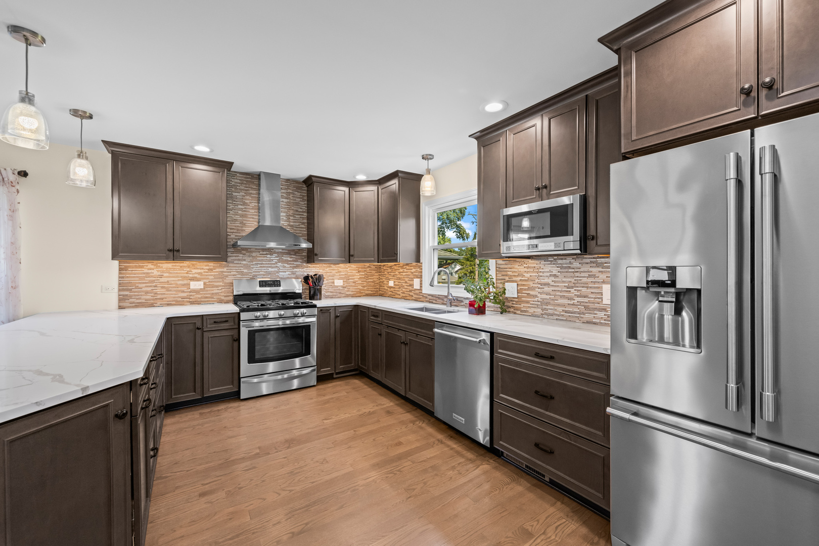 S579 Robbins Street Winfield, IL 60190 - Photo 8 of 36 a kitchen with granite countertop a refrigerator stove and oven