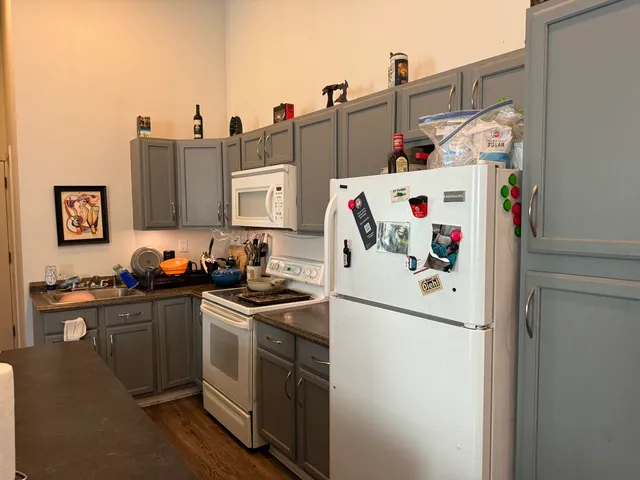 a white refrigerator freezer sitting inside of a kitchen