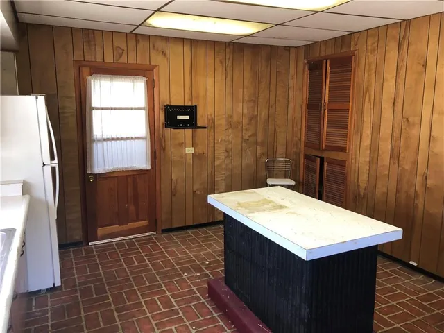 a kitchen with a wooden cabinets and sink